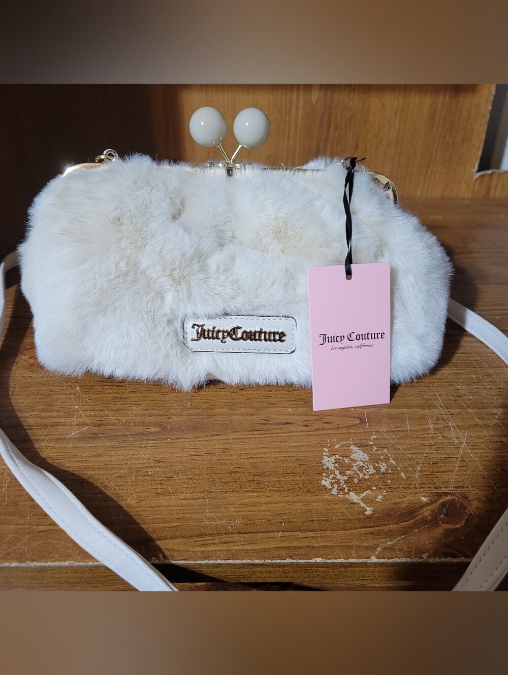 Juicy couture keep it classy frame crossbody in color crystal. Nwt